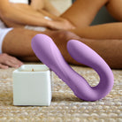 Woman holding the Rabbit Reflexx Vibrator purple color