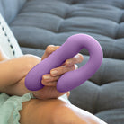 Woman holding the Rabbit Reflexx Vibrator purple color