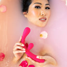 Asian woman model holding the Rabbit Vibrator Pink Color Reflexx 3 