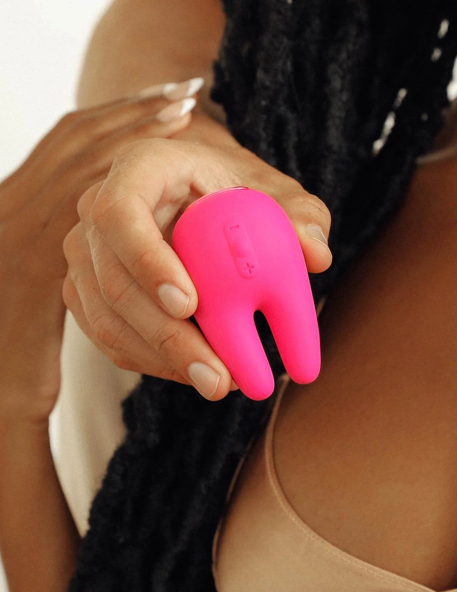 Young couple holding the two prong pink vibrator Form 2 PRO
